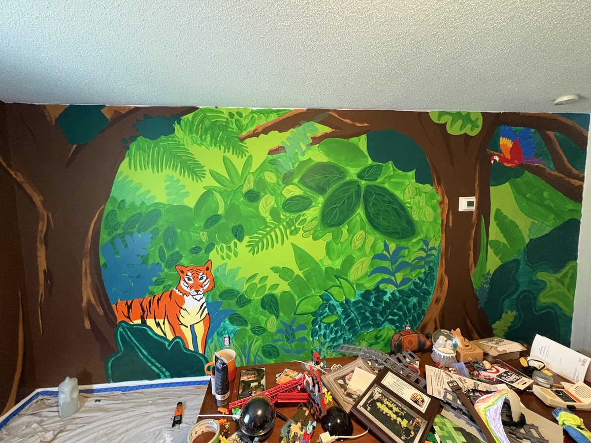 Jungle scene mural with tiger and tropical foliage
